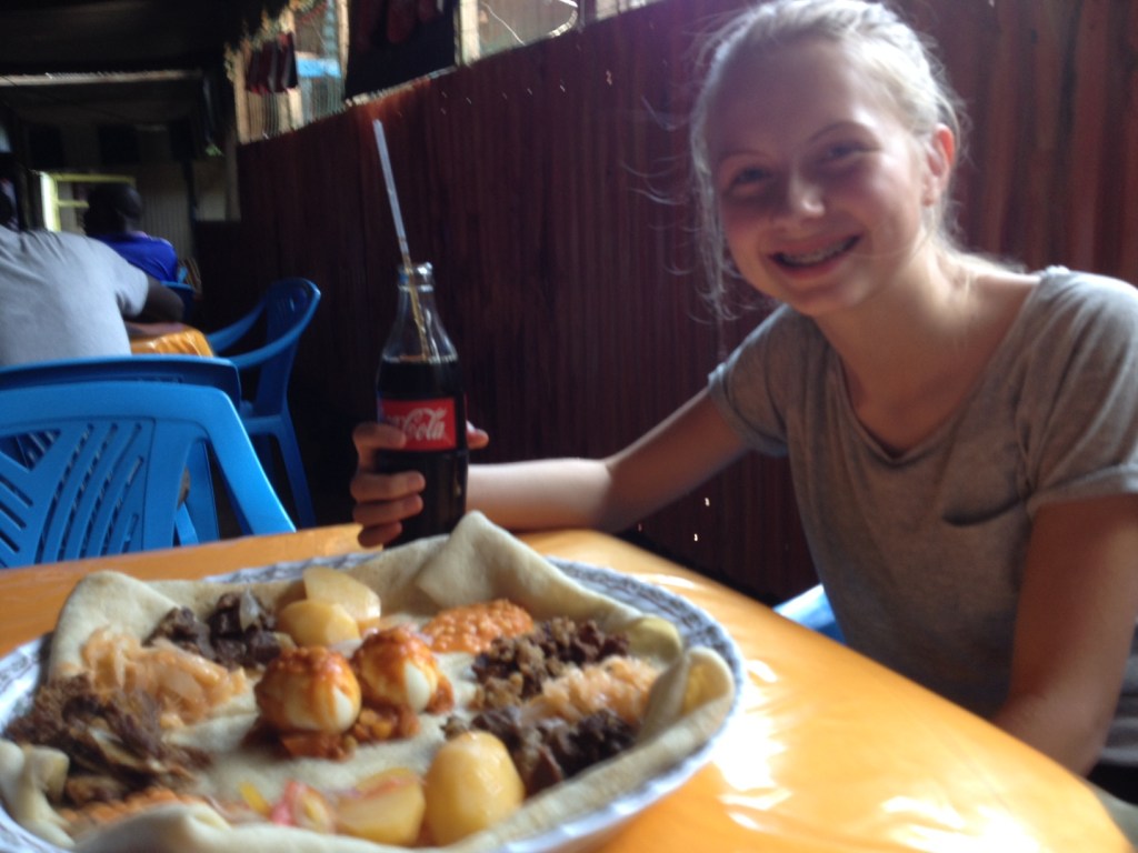 Lydia and Papa enjoyng Ethiopian Food In the Refugee Camp