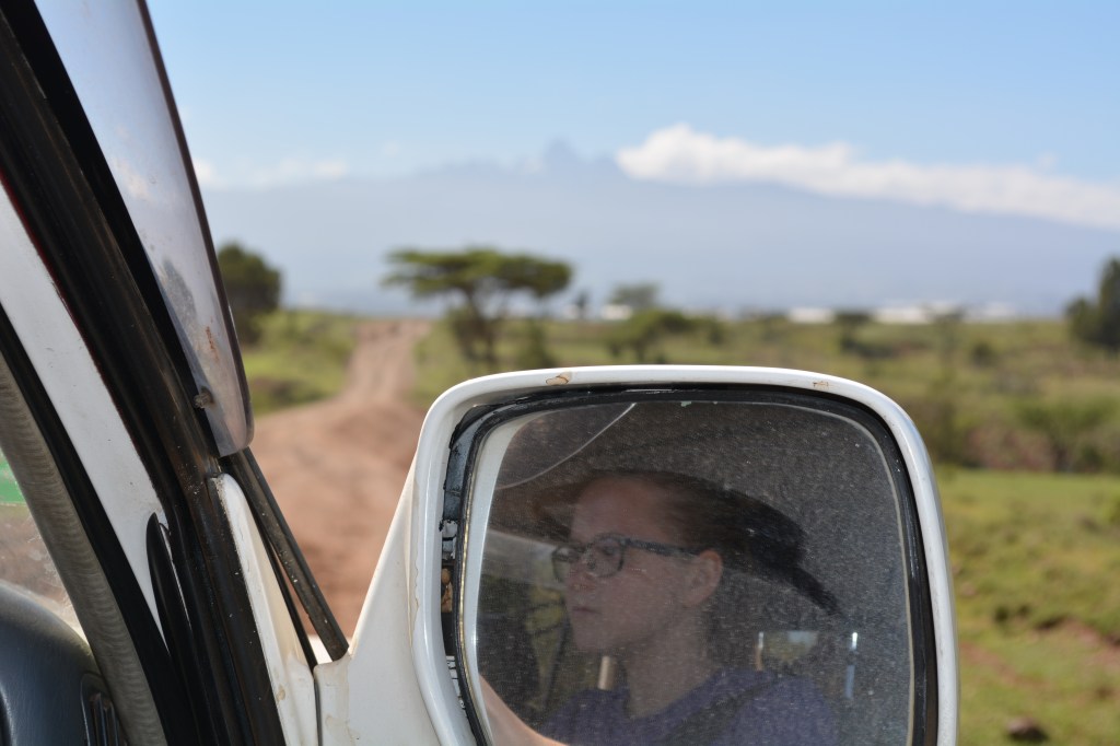 Mt. Kenya in the distance as Sarah drives a bit on one of the remote roads heading home