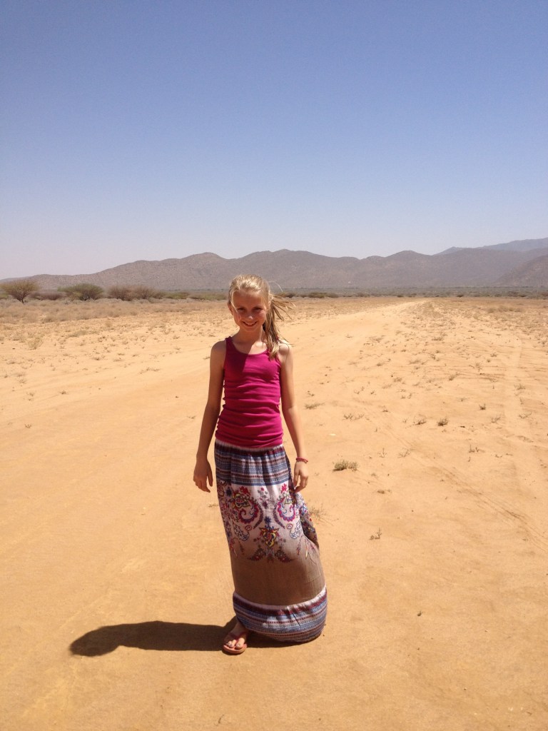 Lydia in the heat on the desert airstrip
