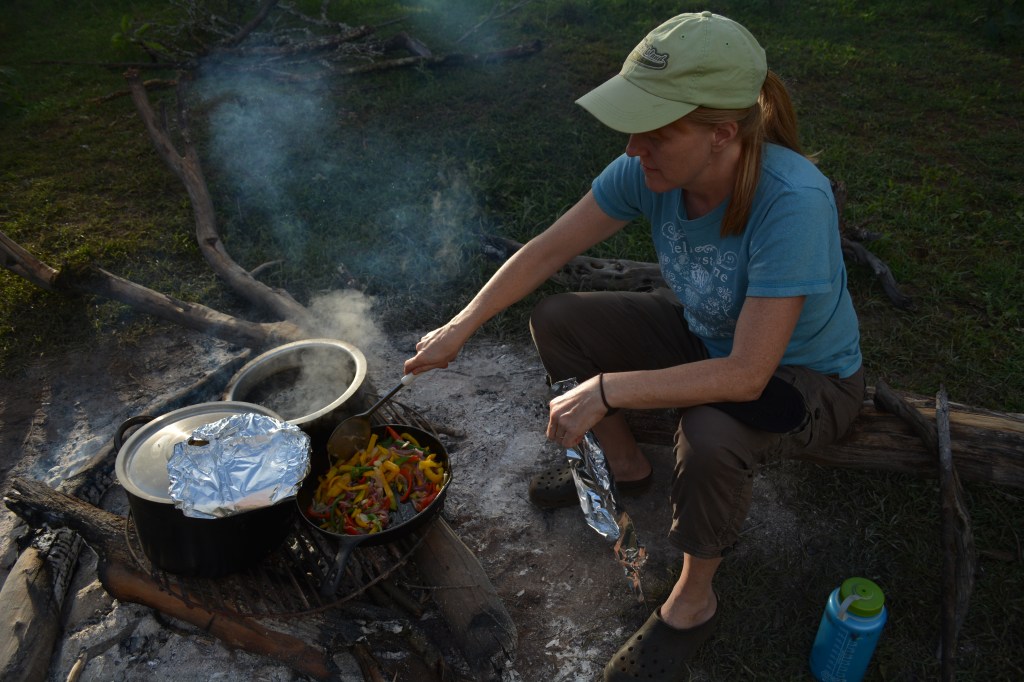Cooking one of the meals over the fire