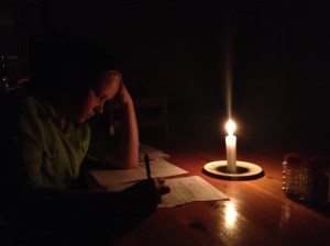 Doing homework by candlelight!