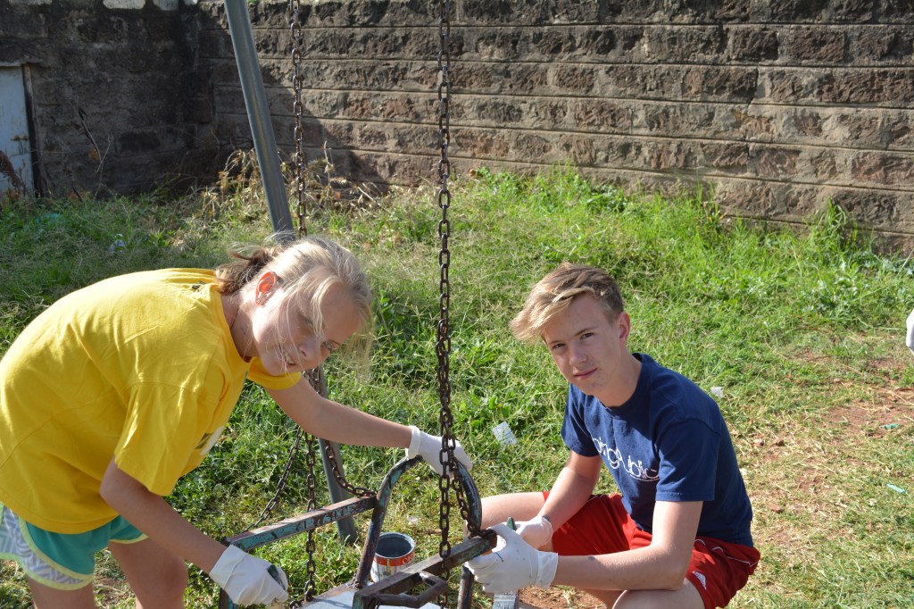 On the Tenth Day of Christmas we repaired, sanded and painted the neighborhood swing set that was in complete disrepair.  It was fun to work on it as a family and make it look new again.