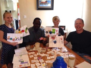 Lydia, Abraham and Dan working hard on learning Kiswahili with our language helper John.