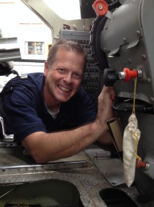 Dan working on the Cessna Caravan rudder trim hose, which needed repairing.