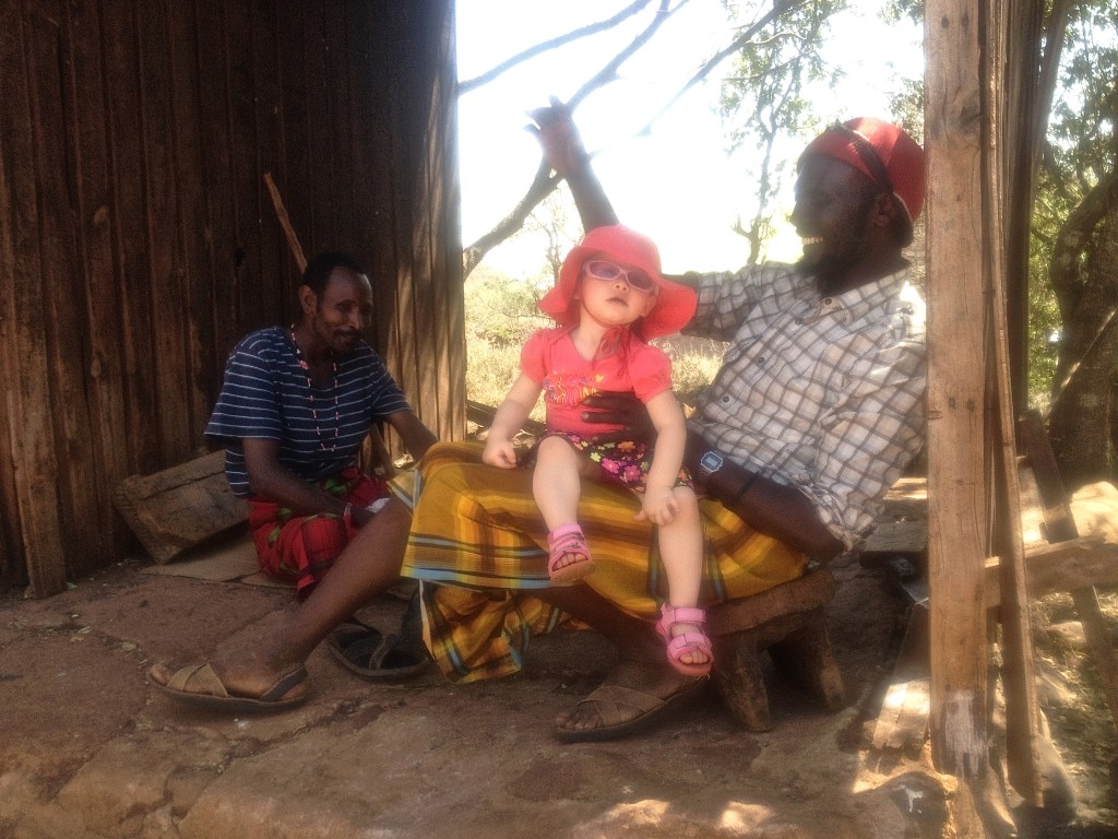 One of the day guards holding Janaie.