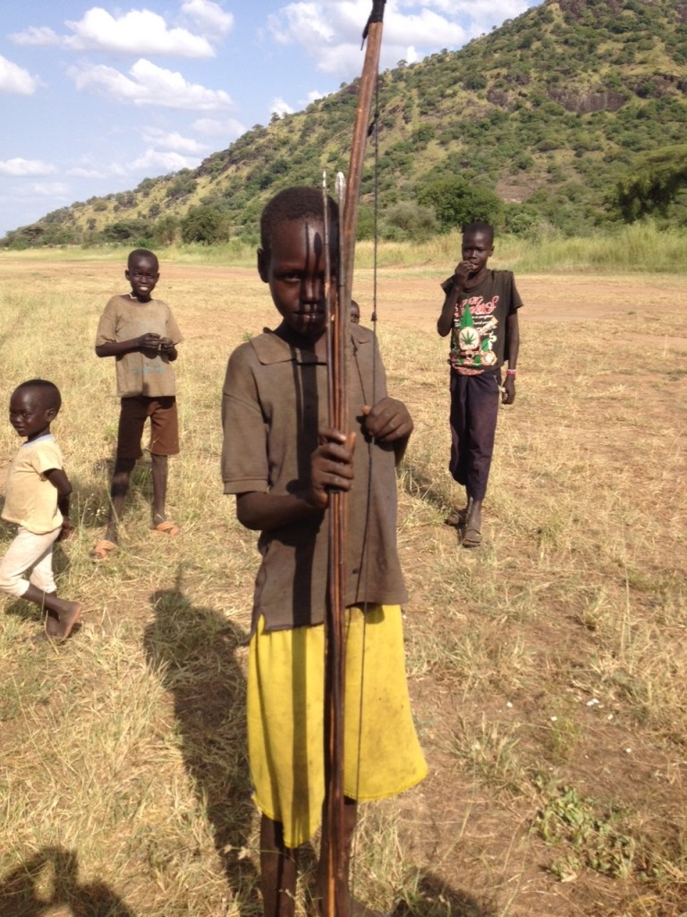 This young man fired his very tall bow for me. It was quite impressive how far the arrow flew. I would not want to be one of the four-legged creatures he hunts!